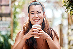 Portrait, smile and woman with a coffee, cafe and relax with happiness, morning espresso or paper cup. Face, person or girl with tea, cappuccino or cheerful with joy, peaceful or calm in a restaurant