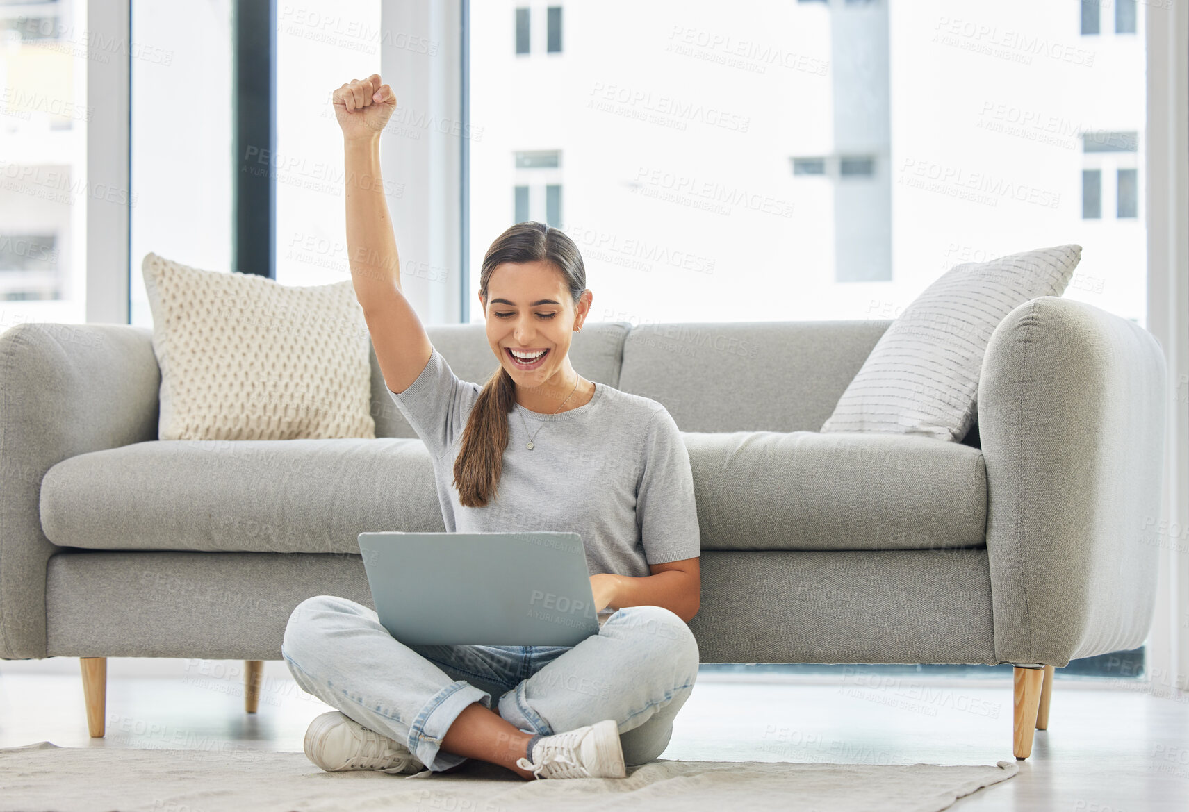 Buy stock photo Winner woman, laptop and fist on floor for success, goal or bonus in trading, stock market or deal. Girl, computer and happy in home living room for cheers, invest or yes for profit, revenue or lotto