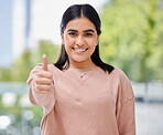 Face, thumbs up and smile portrait of a woman in a house with sign for support, thank you or yes. Happy Indian female model person show hand or like emoji for success, trust and goals or good job