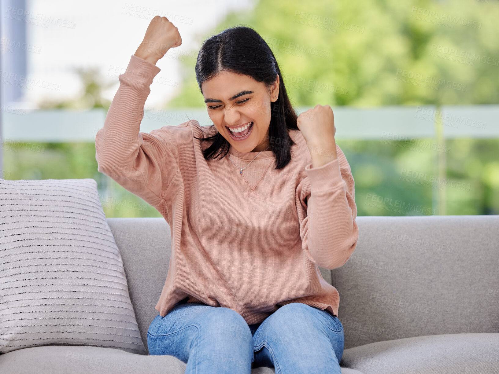 Buy stock photo Woman, sofa and fist celebration in home living room, excited and winning with goals, motivation or prize. Girl, winner and happiness for success, celebrate and achievement on lounge couch in house