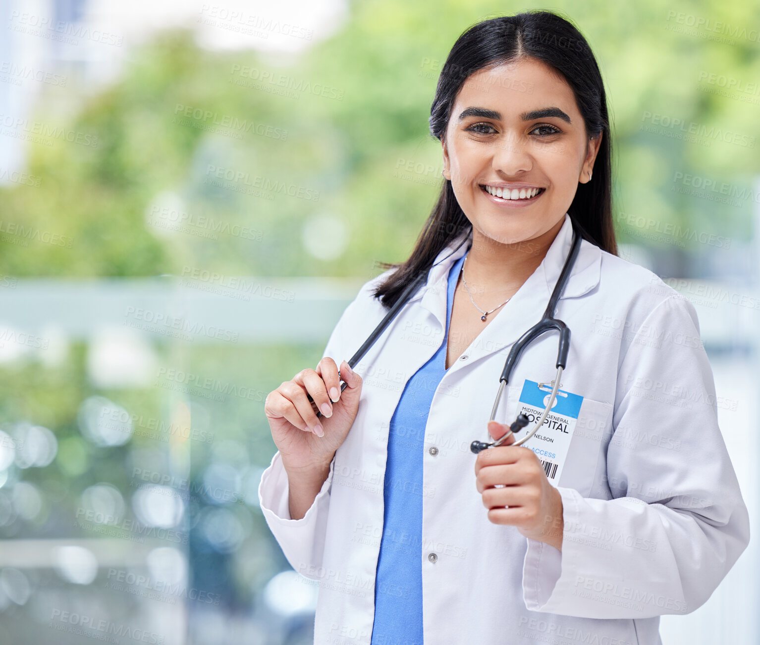 Buy stock photo Young woman, doctor and hospital portrait with smile, stethoscope and healthcare career with pride. Female latino medic, happy health and wellness expert with medical job, clinic and help in services