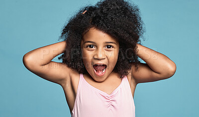 Buy stock photo Portrait, black girl child and excited being surprised, shocked and touch hair with blue studio background. Wow, African American female kid or natural hair or afro have fun, smile and happy for play