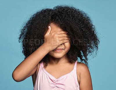 Buy stock photo Girl, African and hand of kid hiding face with concentration busy with mental countdown for game. Young black child with afro covering eyes with focus to play hide and seek with blue studio mockup