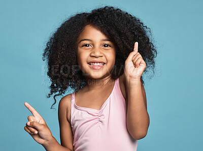 Buy stock photo Children, dance and fun with a girl kid dancing in studio on a blue background for freedom or expression. Kids, happy and smile with a cute female child dancer feeling positive or carefree inside