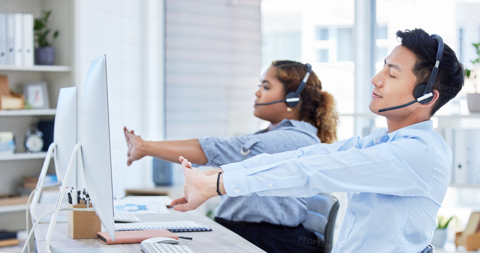 Buy stock photo Call center, tired and a team stretching at desk with a computer and headset for telemarketing. Diversity office with man and woman agent exercise to relax or start sales, customer service or support