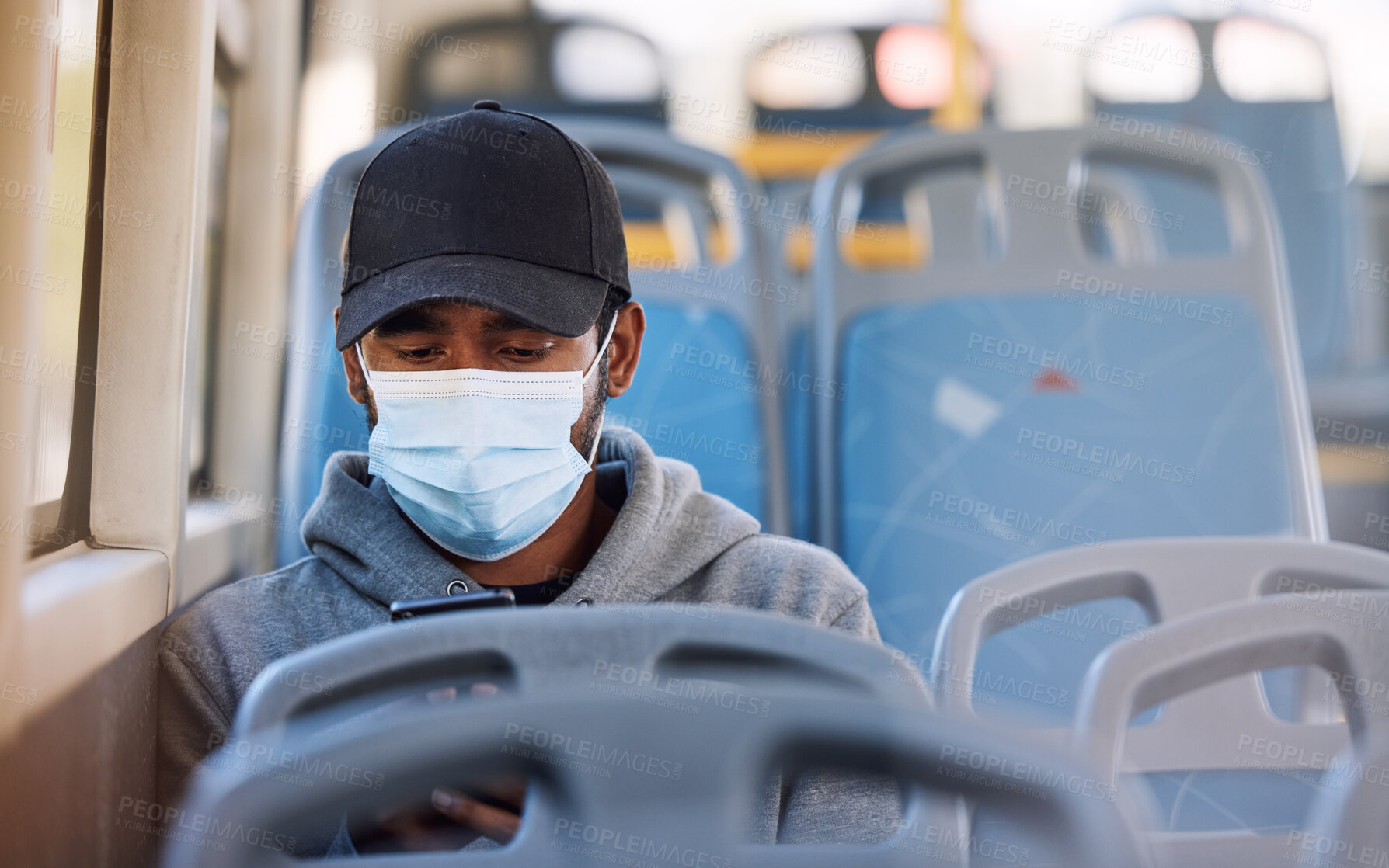 Buy stock photo Man, mask or travel in bus with phone, cold protection or technology for social media on trip. Young person, cap or medical cover on mouth for flu virus, transport safety or cellphone to read ebook