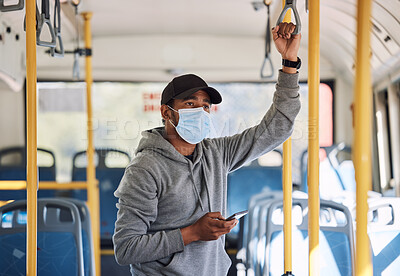 Buy stock photo Man in bus with mask, phone and travel to city in morning, checking service schedule or social media. Public transport safety in covid, urban commute and person in standing with smartphone connection