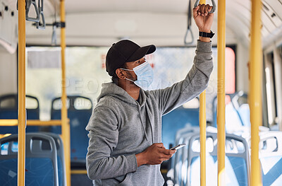 Buy stock photo Man in bus with mask, phone and commute to city in morning, checking service schedule or social media. Public transport safety in covid, urban travel and person in standing with smartphone connection