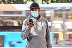 Man in city with mask, phone and morning travel at bus stop, checking service schedule or social media. Public transport safety in covid, urban commute and person in street with smartphone connection