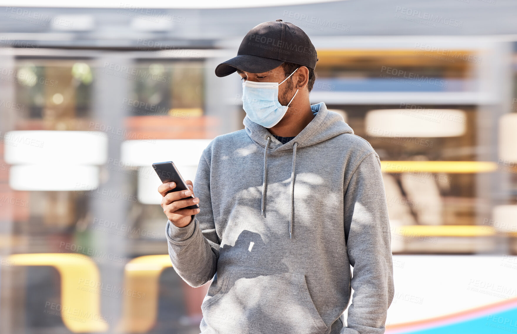 Buy stock photo Man, mask or cellphone in city, walk and cold protection or text notification on travel in town. Young person, urban or medical cover on mouth for flu virus, transport safety for healthcare crisis