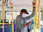 Man in bus with mask, mobile app and travel to city in morning, checking service schedule or social media. Public transport safety in covid, urban commute and person in standing with phone connection