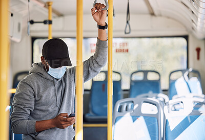 Buy stock photo Man in bus with mask, phone and reading on morning travel to city, checking service schedule or social media. Public transport safety in covid, urban commute and person in standing with smartphone.