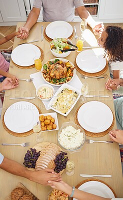 Buy stock photo Pray, food and family friends dinner at a table with gratitude, love and religion faith before eating. Praying at a meal as a spiritual and christian practice holding hands together for worship 