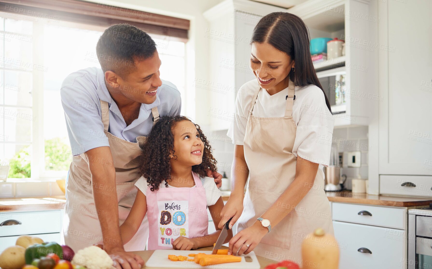 Buy stock photo Happy family, love and cooking healthy food in the kitchen in preparation for a vegan diet for dinner or lunch together. Development, father and mother teaching child a vegetable salad recipe at home