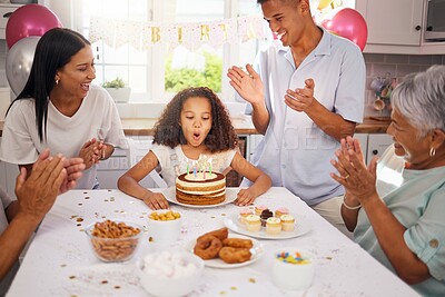 Buy stock photo Birthday, children and cake with a girl in celebration with family at a party while blowing out her candles to make a wish. Kids, applause and happy with a daughter, parents and grandparents at home