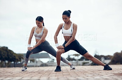 Buy stock photo Fitness, city workout and women stretching together before marathon running. Health, wellness and sports, motivation to exercise with dynamic or static flexibility and balance performance training.