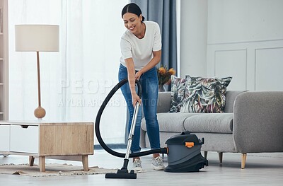 Buy stock photo Black woman vacuum cleaner, smile in living room and cleaning tiles floor in home for hygiene. Woman cleaner, happy with appliance for housekeeping work on flooring in house for dust or dirt indoors