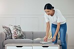 Cleaning, living room books and hygiene woman tidy apartment, home or desk table surface for domestic housework. Magazine, maid service and casual house cleaner working, housekeeping or doing chores