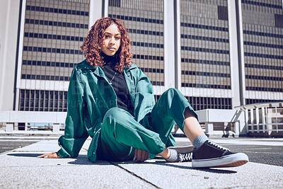 Buy stock photo Fashion, city and gen z portrait of girl resting on outdoor floor of urban building in New York. Youth, edgy and young woman in town with retro and sporty 90s clothes style relaxed on ground.

