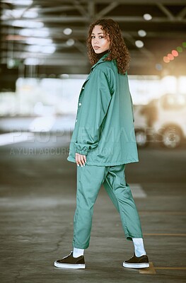 Buy stock photo Fashion, style and woman in urban parking lot posing in stylish, trendy and designer clothing. Creative, fashionable and young black woman in city car park or garage with confidence in modern outfit