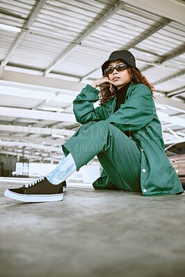 Buy stock photo Fashion, style and portrait of woman in parking lot with trendy, stylish and designer clothing. Beauty, freedom and black woman in sitting pose on floor of car park in cool, edgy and urban outfit