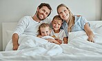 Family, children and bed with a girl, sister and parents in the bedroom of a home to relax together in the morning. Portrait, love and smile with a happy mother, father and daughter siblings bonding