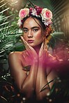 Crown, flower and portrait of woman in studio for skincare, beauty and product from nature, wellness and makeup. Jungle, rose and face of girl model with leaf, plant and creative forest aesthetic