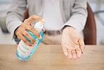 Hand sanitizer, safety and spray business woman at desk for bacteria, covid or healthcare. Cleaning, disinfection and employee hands and antibacterial soap for hygiene, virus or pandemic prevention