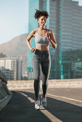 Buy stock photo Running, fitness and city with a sports woman on a street for a cardio or endurance workout alone in the day. Health, training and exercise with a female athlete or runner on an asphalt road in town