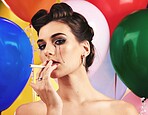 Makeup, beauty and smoking with a model woman in studio on a balloon background for nicotine addiction. Portrait, cosmetics and cigarette with a female posing to promote a tobacco smoke product