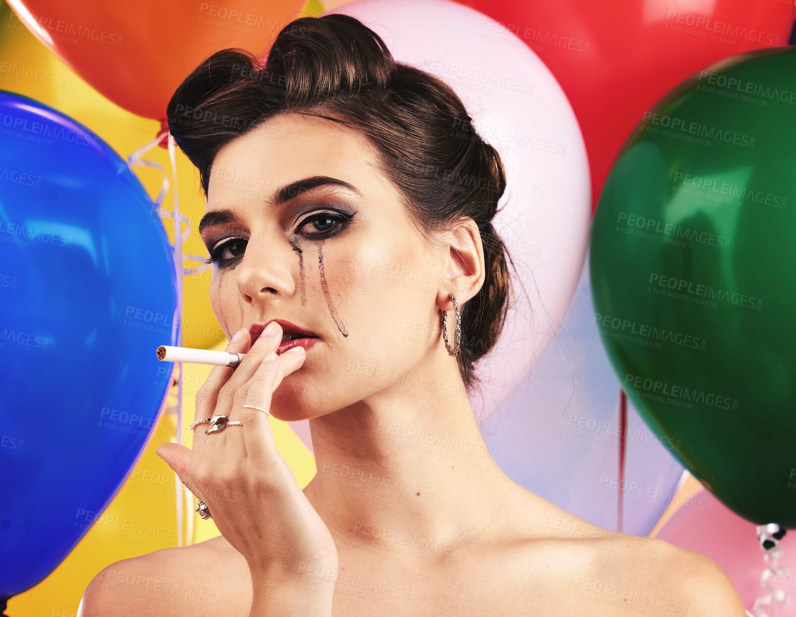 Buy stock photo Makeup, beauty and smoking with a model woman in studio on a balloon background for nicotine addiction. Portrait, cosmetics and cigarette with a female posing to promote a tobacco smoke product