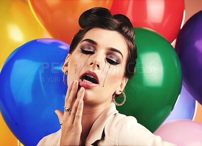 Buy stock photo Woman, balloon and sad cry in studio with makeup tears, depression or anxiety at birthday. Mental health model, party or depressed by balloons, frustrated mascara crying or moody with stress at event