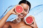 Fruit, skincare and black woman smile with grapefruit for facial wellness and skin glow. Portrait of a woman model with water splash and vitamin c for beauty, cosmetic nutrition and natural detox