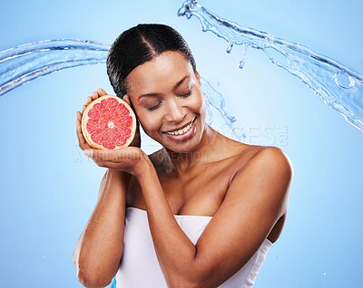 Buy stock photo Water splash, grapefruit and skincare of a black woman holding fruit, diet food and nutrition. Vitamin c, cosmetic health and wellness of a model with water happy about zen beauty and healthy eating