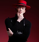 Man, fashion style or vitiligo skin on red background studio in empowerment, self love or attitude. Portrait, aesthetic or model with cool, stylish or edgy clothes or South Africa facial pigmentation