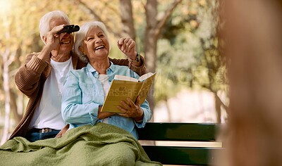 Buy stock photo Love, senior couple and watching birds with book, binocular and romantic together. Romance, mature man and elderly woman in nature, happy and talking about animals, notebook and park bench for hobby.