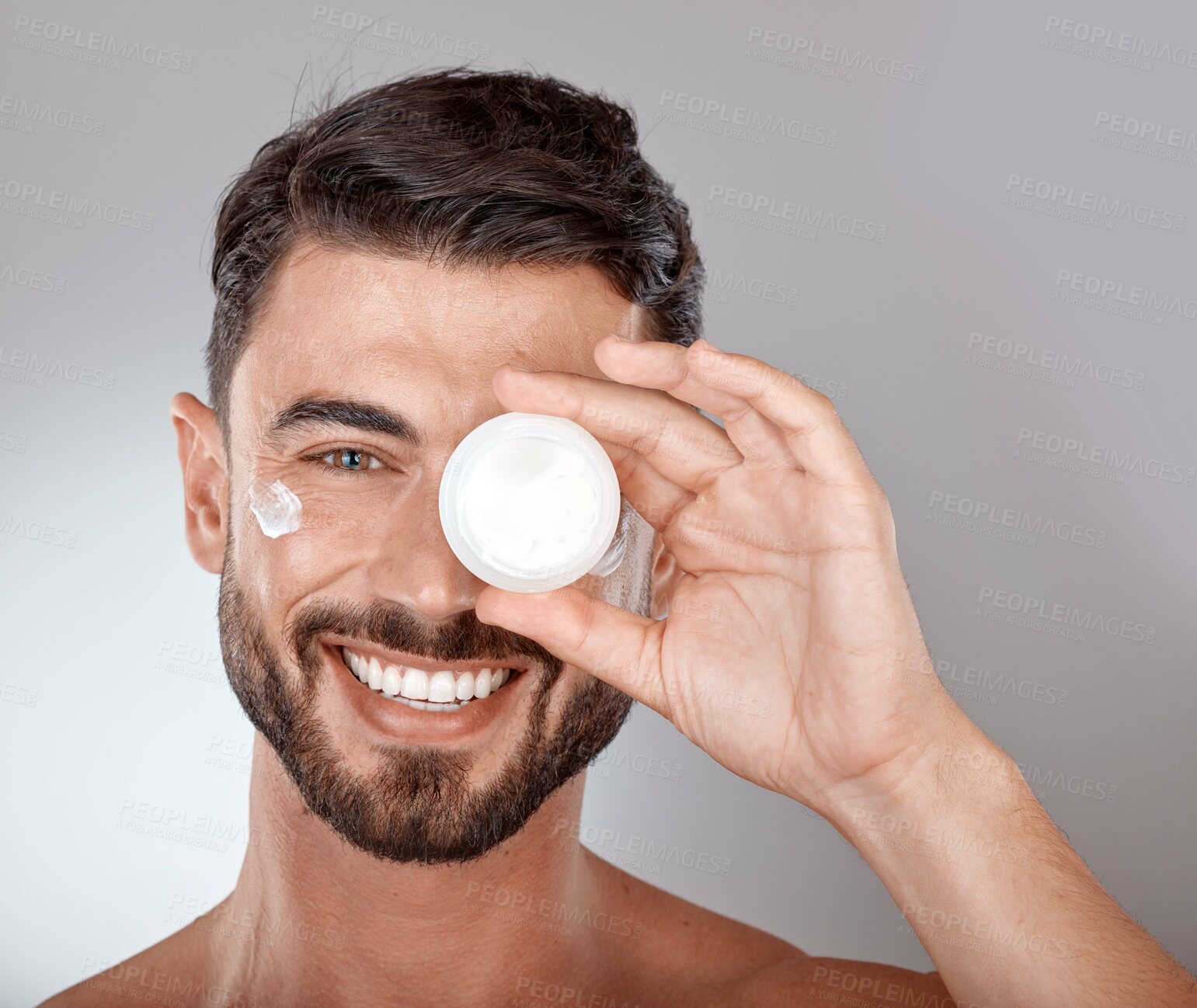 Buy stock photo Beauty, skincare and portrait of man with cream on gray background for wellness, spa treatment and hygiene. Cosmetics, grooming and face of male model with lotion, self care and facial treatment