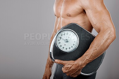 Buy stock photo Fitness, man and scale for body wellness nutrition, diet and exercise advertising for weight loss. Lose weight and workout lifestyle model with muscle on gray studio mockup for health marketing.

