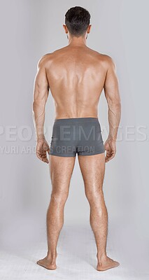 Buy stock photo Man, body muscles and back on studio background for fitness check, workout training goals or exercise wellness power. Model, bodybuilder and strong athlete on gray backdrop for healthcare gym target