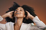 Hair care, beauty and black woman with makeup, hair and happy with afro and cosmetic care, face and skincare. Hairstyle with facial, natural curly hair texture and pride against studio background