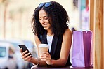 Shopping bags, relax and phone with black woman with coffee for purchase, online deal and social media. Retail therapy, consumer and sales with girl customer buying in city  for store and products