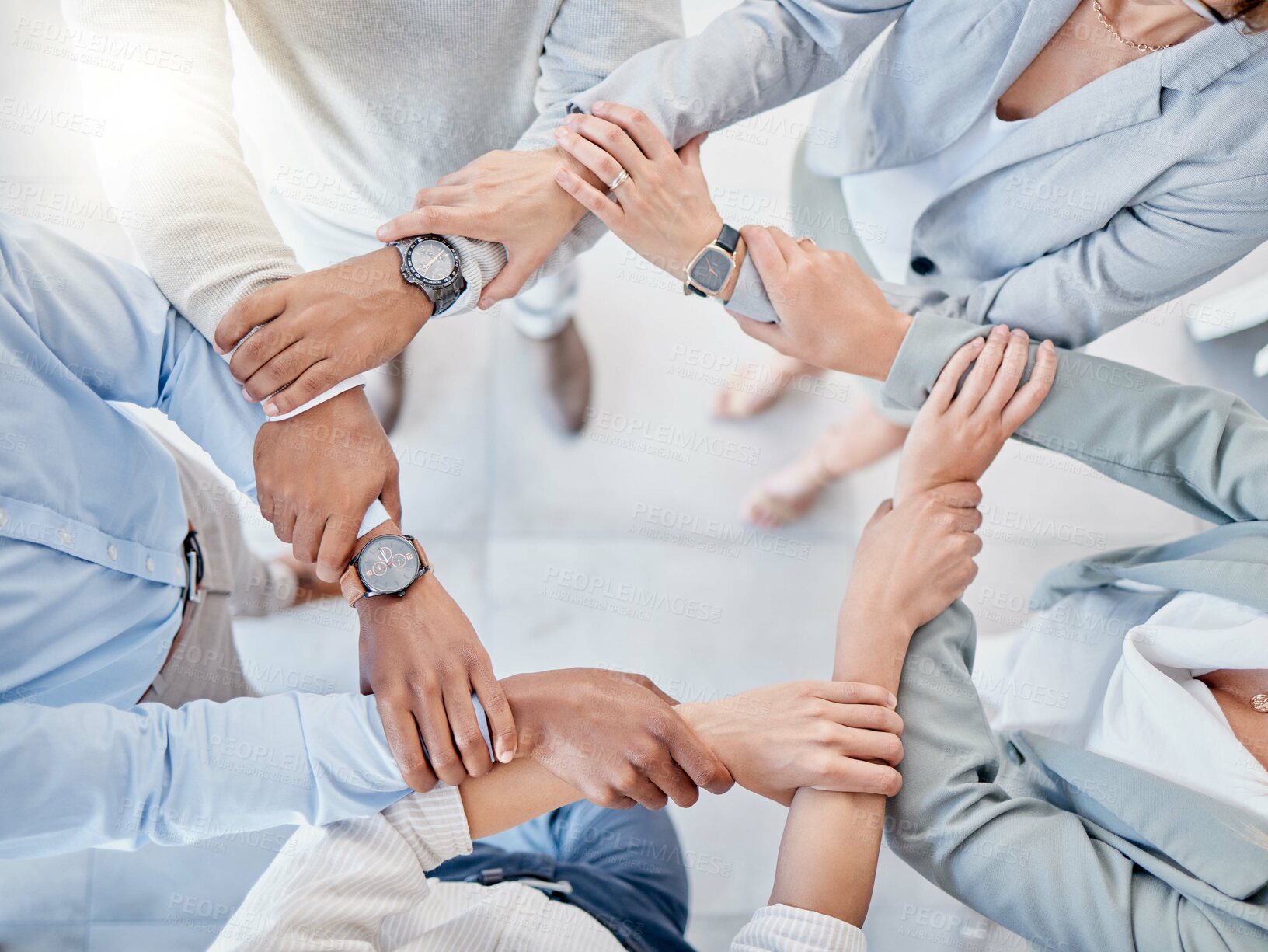 Buy stock photo Above business people, trust circle and holding hands for motivation, teamwork or group goal at finance company. Businessman, women and helping hand for support, diversity and solidarity in workplace
