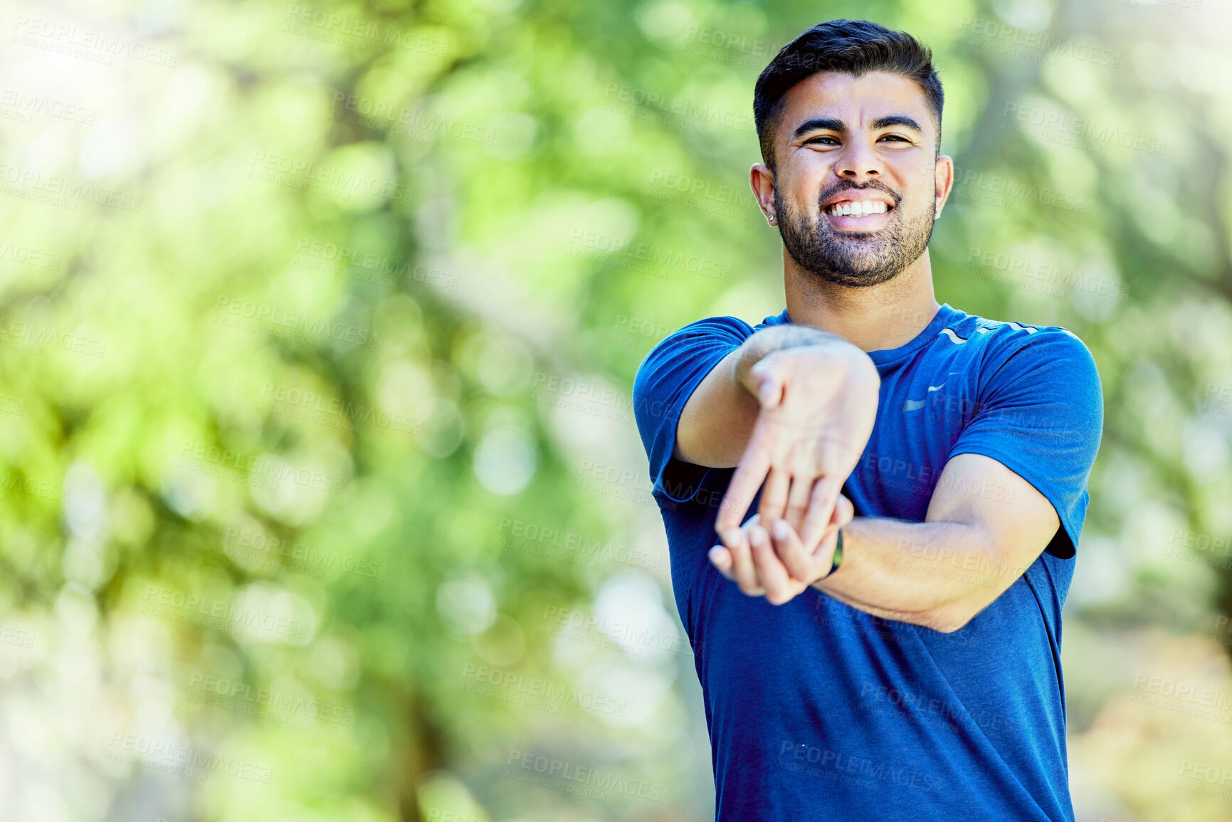 Buy stock photo Exercise, mockup or stretching arm with a man outdoor in nature for a warm up before a workout. Fitness, mock up and training with a male athlete on a natural green background for health or cardio