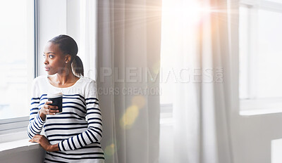 Buy stock photo Coffee, thinking and mockup with a black woman in a home, standing by a window looking at the view. Idea, flare and mock up with a young female drinking a beverage to relax alone in her house