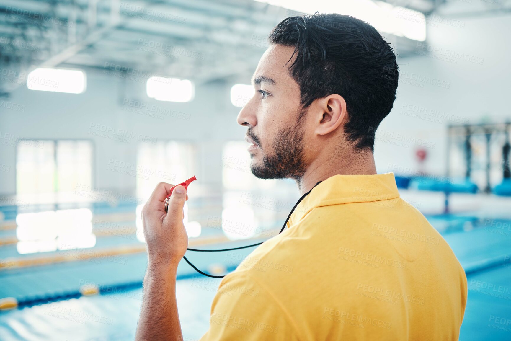 Buy stock photo Lifeguard, whistle and swimming pool safety by man watching at indoor facility for training, swim and practice. Pool, attendant and guy water sports worker monitoring exercise, danger and swimmer