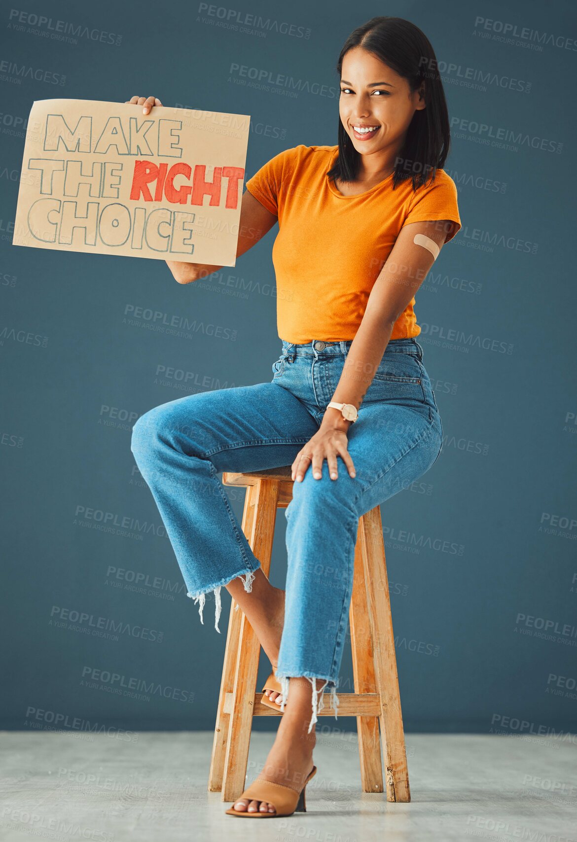 Buy stock photo Woman, vaccine poster and studio portrait with smile, stop covid and healthcare opinion on cardboard. Happy gen z girl, billboard or wellness decision with plaster, sign and happy for safety in home