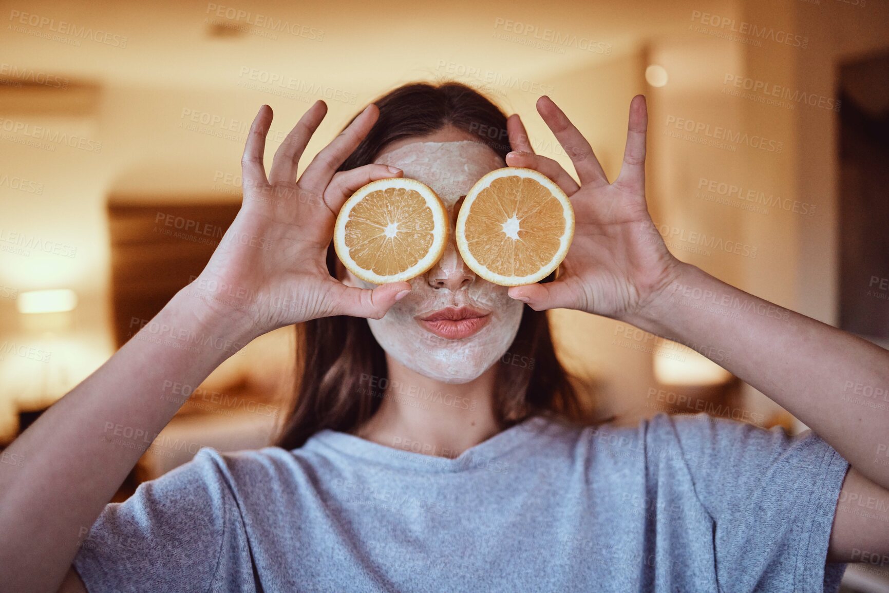 Buy stock photo Orange, eyes and skincare facial for woman in a bedroom, grooming and having fun with skin treatment. Face, mask and girl relax with fruit product, hygiene and beauty routine, with vitamin c at home
