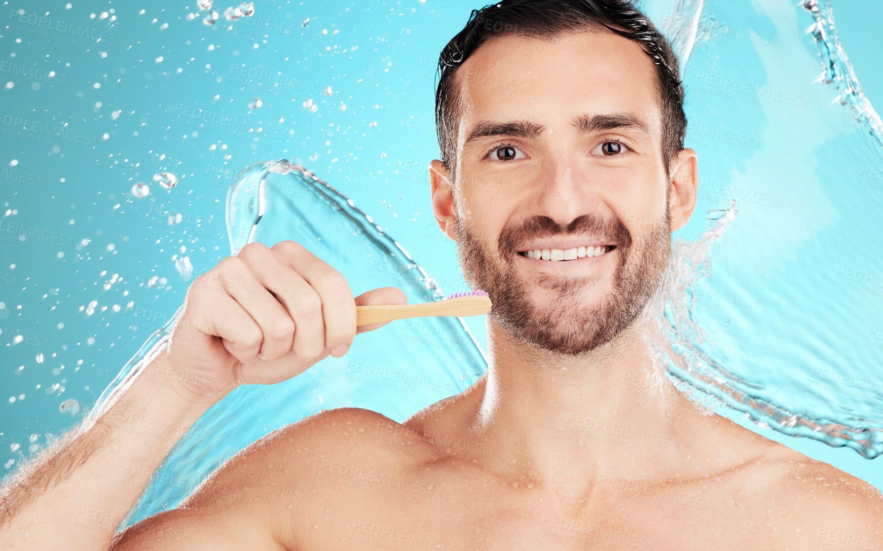 Buy stock photo Eco friendly toothbrush, water and portrait of man on blue background for wellness, hygiene and brushing teeth. Cleaning, dental and face of male with toothpaste for grooming, whitening and health