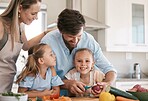 Children and parents cooking in kitchen with vegetables for healthy lunch, organic food or meal prep. Family, smile and portrait of girl learning, develop chef skills and helping peel ingredients