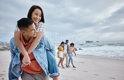 Buy stock photo Happy, piggyback or couple of friends at a beach on a relaxing holiday vacation bonding in nature together. Love, man and Asian woman with smile at sea enjoys traveling on ocean trips in Miami, USA